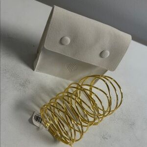 White Clutch with Gold Bangles